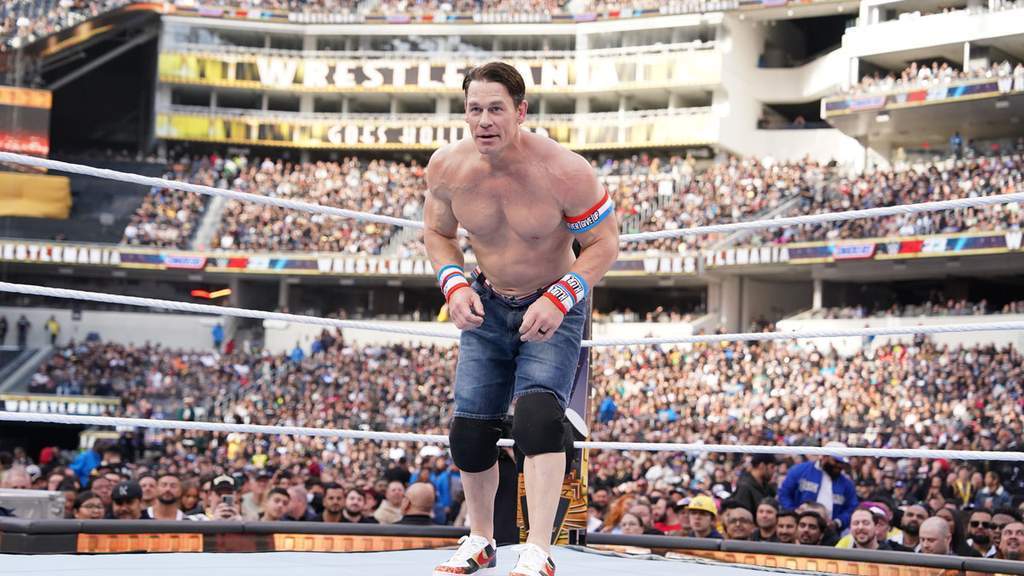 WWE legend John Cena smiling during an interview.
