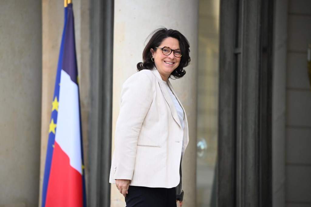 French Sports Minister Marina Ferrari speaking at an official press conference.