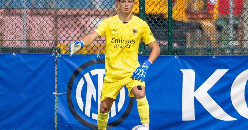 Young Italian goalkeeper Alessandro Longoni holding a PSG shirt