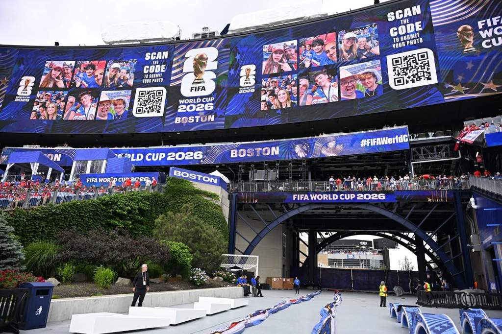 A spectacular modern football stadium filled with fans during a tournament match